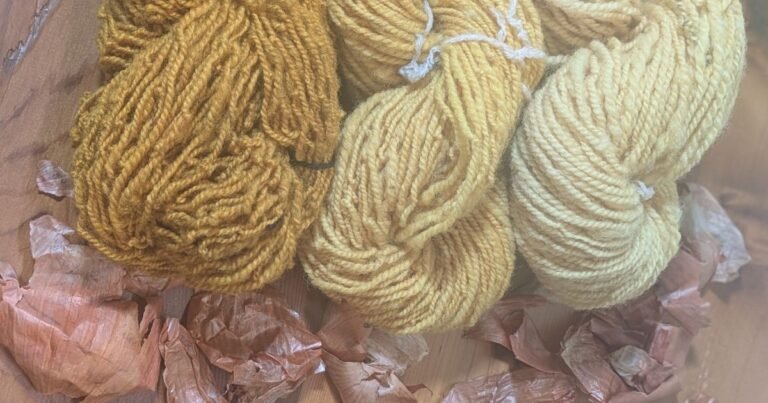 3 skeins of yarn in shades of yellow showing natural dyeing with onion skins
