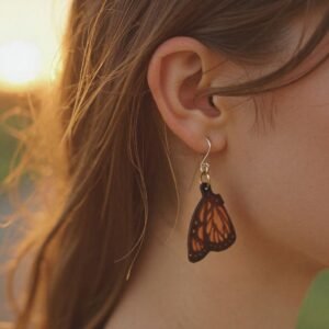 woman wearing a beautiful monarch butterfly leather earring.
