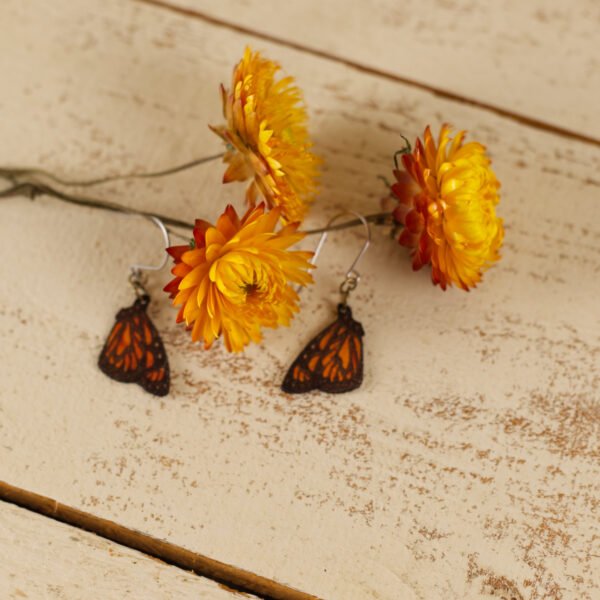monarch small flower small leather monarch butterfly earrings displayed with strawflowers